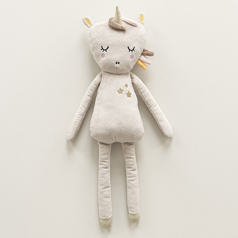 Une petite fille de 5 ans et son doudou licorne Photos